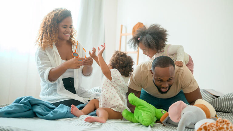 family with young kids playing together