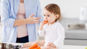 A baby is introduced to solid food.