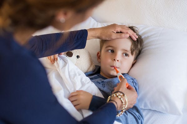 Boy with fever and flu