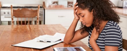 Teen reviewing resources on her tablet