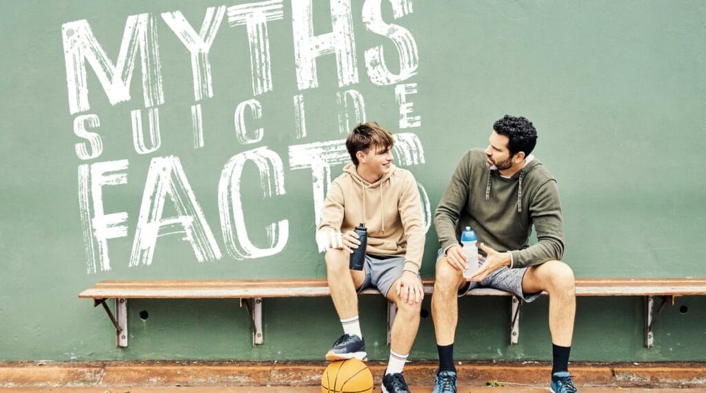 Father and son on a bench in the gymnasium