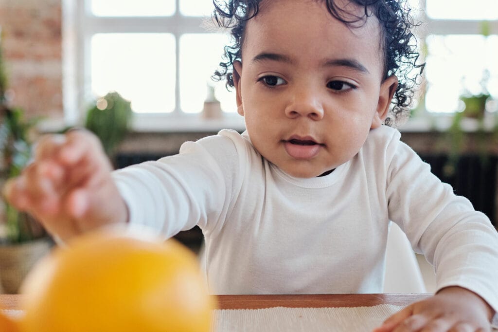 Toddler development: reaching, grasping and manipulating objects.