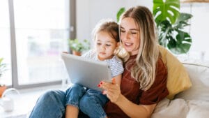 Mother and daughter using a tablet.