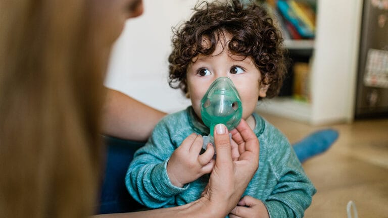 young baby boy getting a breathing treatment