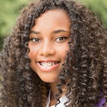 Teen smiling and showing beautiful teeth