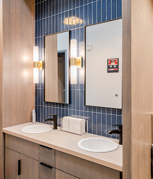 Sinks, mirrors, and lights at the South Jordan office.