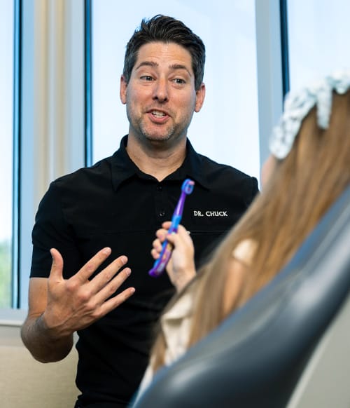 Chuck Odion, DDS with a pediatric dental patient
