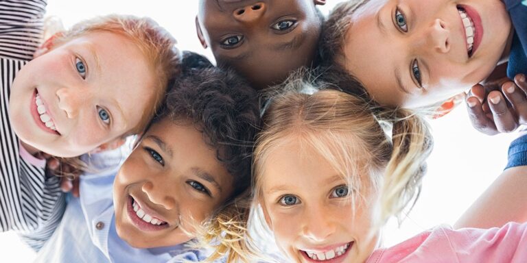 Smiling kids looking into the camera