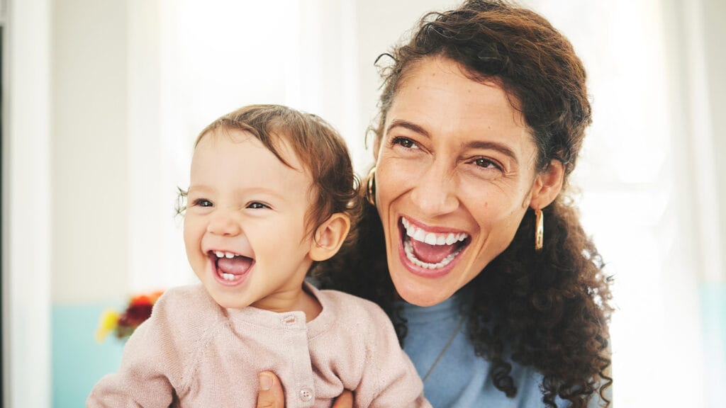 Cheerful smiling mother and daughter