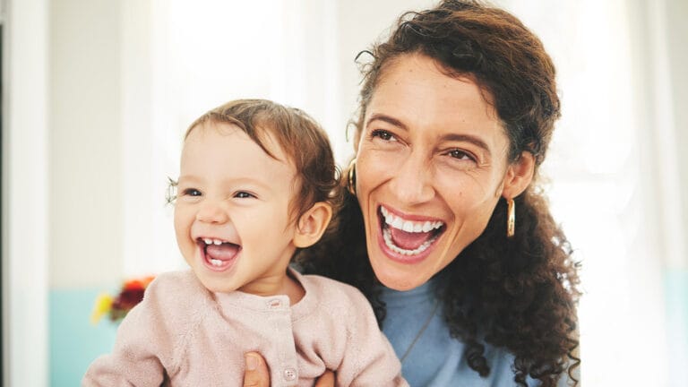 Cheerful smiling mother and daughter