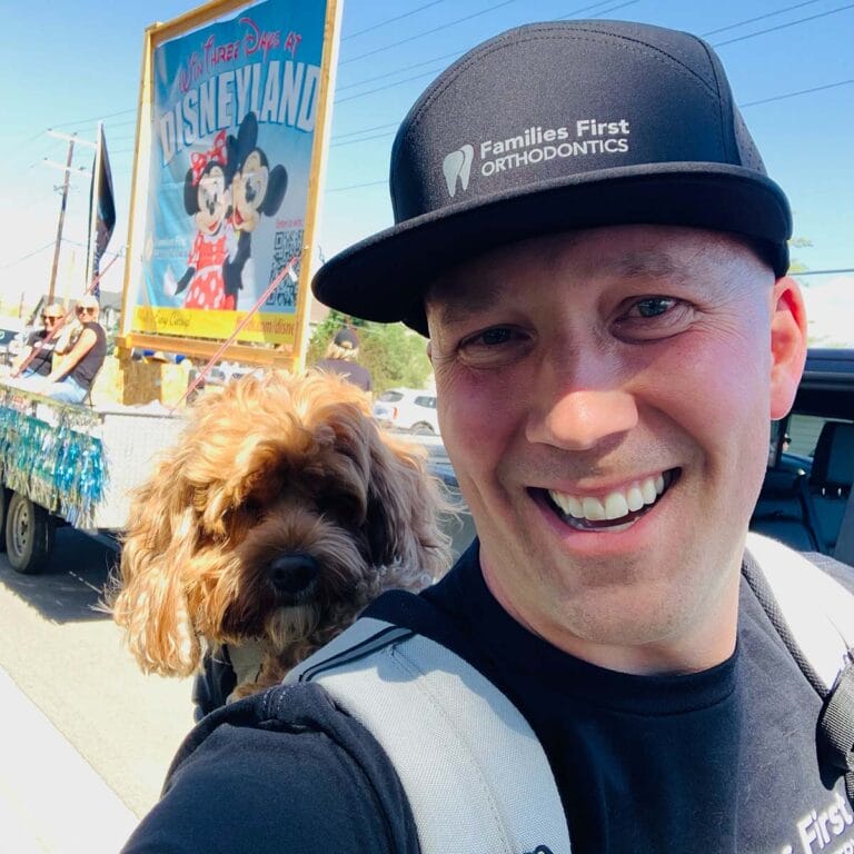 Dr. Lund with his dog in a Herriman parade