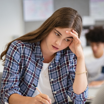 Anxious teen in school classroom