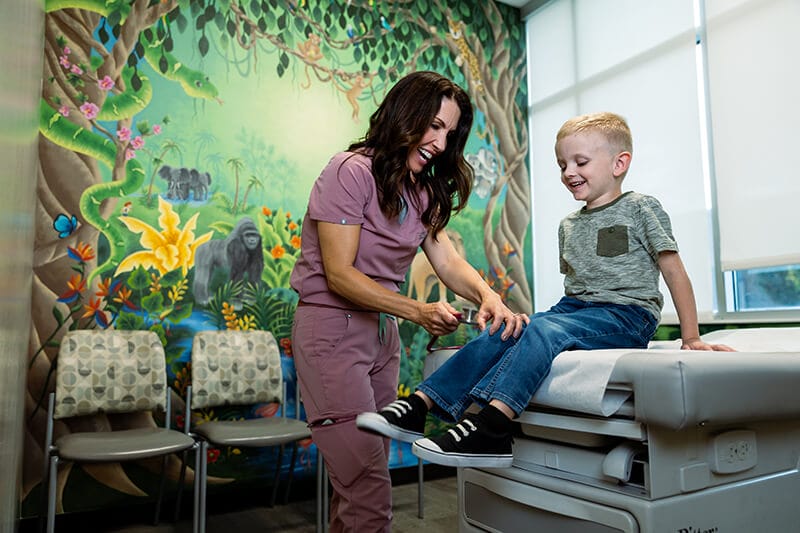 A happy boy and his pediatrician