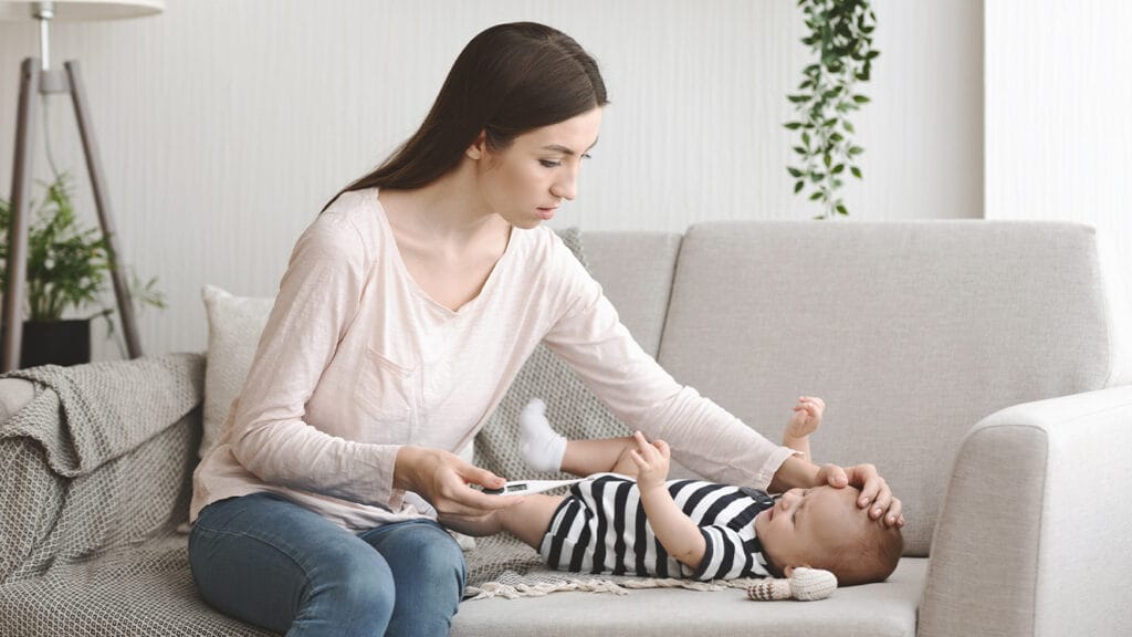 Mom checking on her baby's temperature