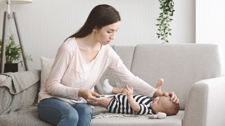 Mom checking on her baby's temperature
