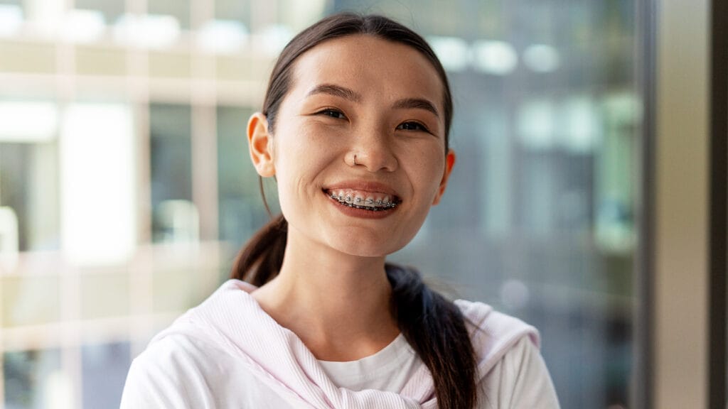young business woman smiling with braces
