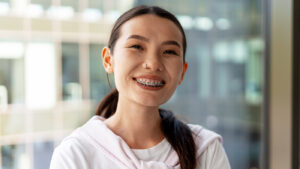 young business woman smiling with braces