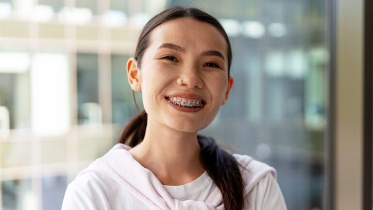 young business woman smiling with braces
