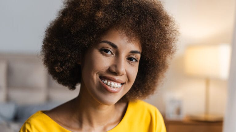 Young woman with clear braces